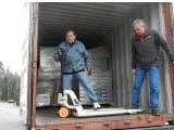 Container for Antigua being loaded with computers and more.