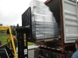 Container for Antigua being loaded with computers and more.